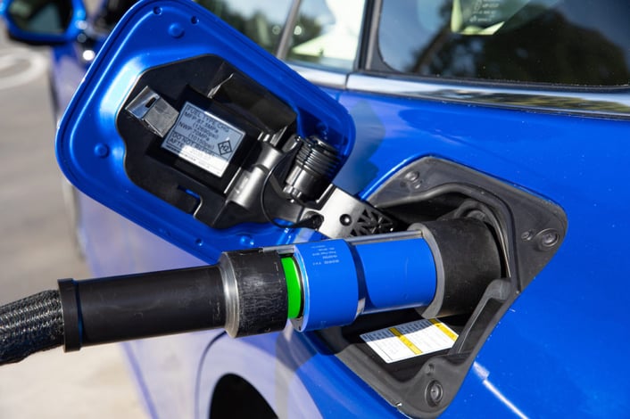 Photo of Toyota Mirai hydrogen fuel cell car being refueled to illustrate blog post about ammonia as a fuel and as a way to distribute hydrogen as a fuel