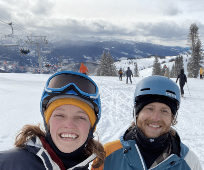 Photo of Reagan Cline and Ben Weinberg on Colorado ski slope to illustrate story about their using carbon offsets from Cloverly to neutralize the carbon impact of their road trip