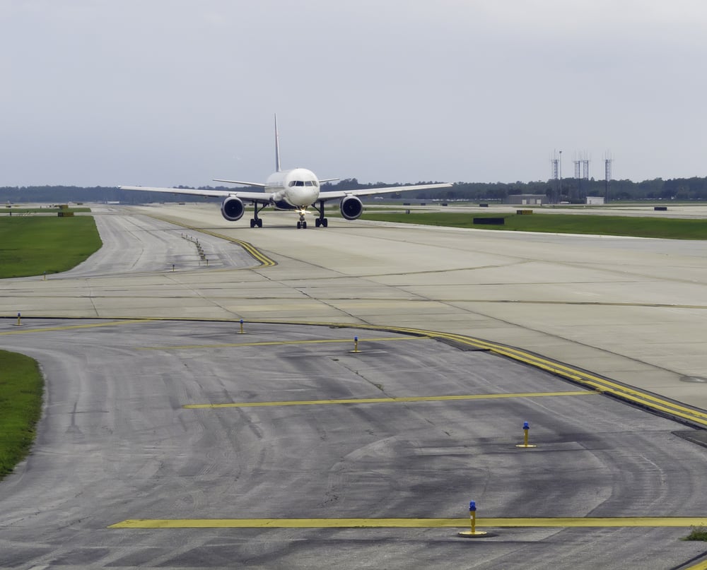 Passenger jet taxiing along runway before takeoff